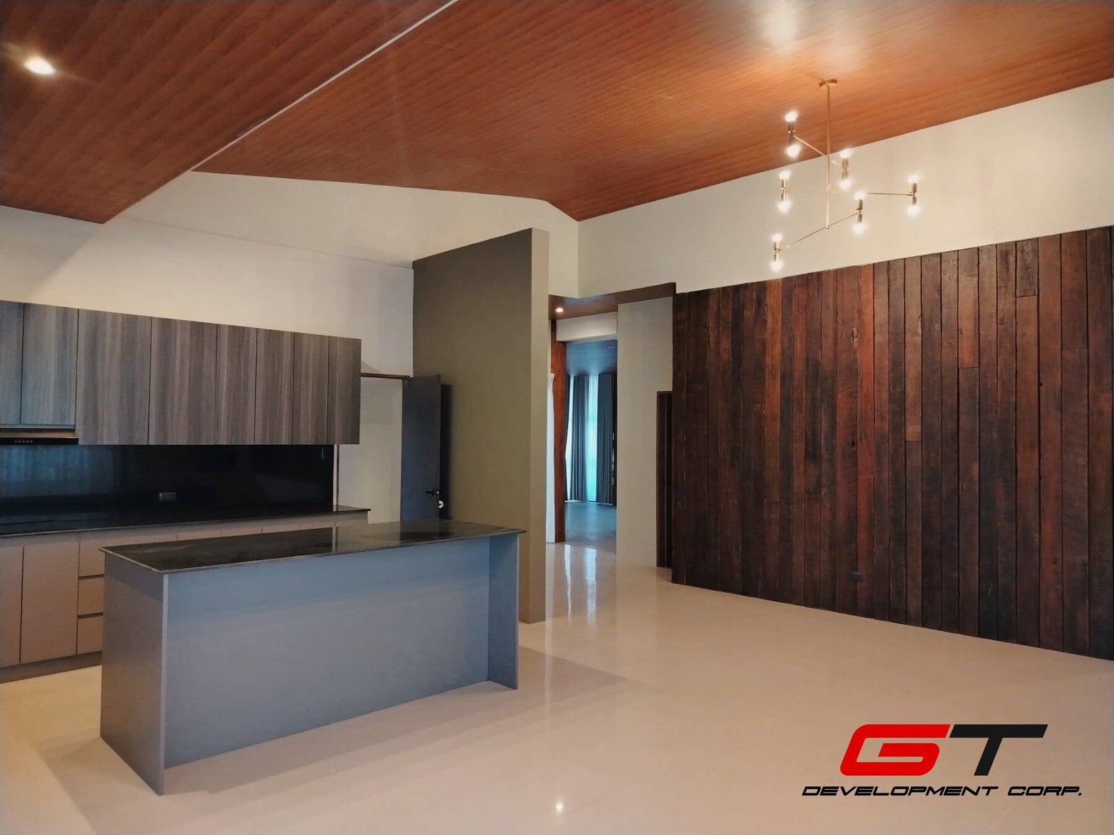 Kitchen with a blue island and dark timber cabinetry under a timber ceiling