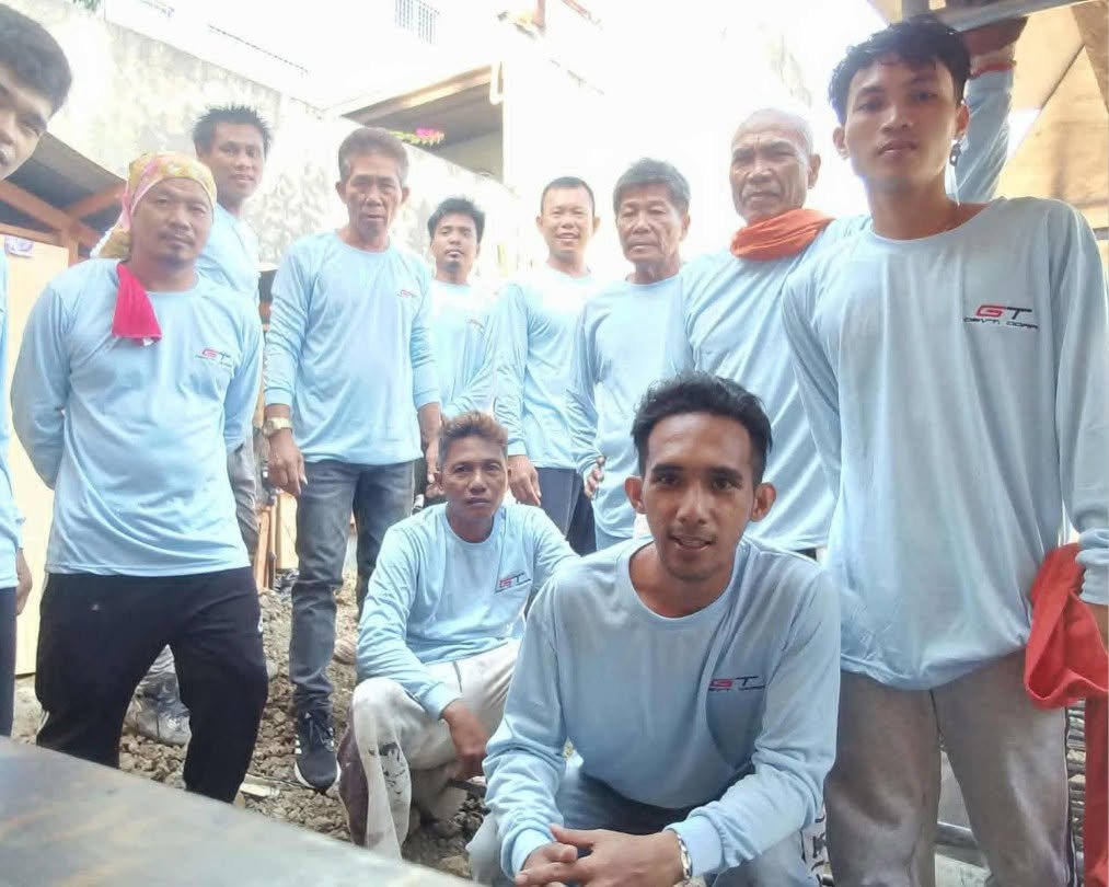 GT construction crew members posing together outdoors