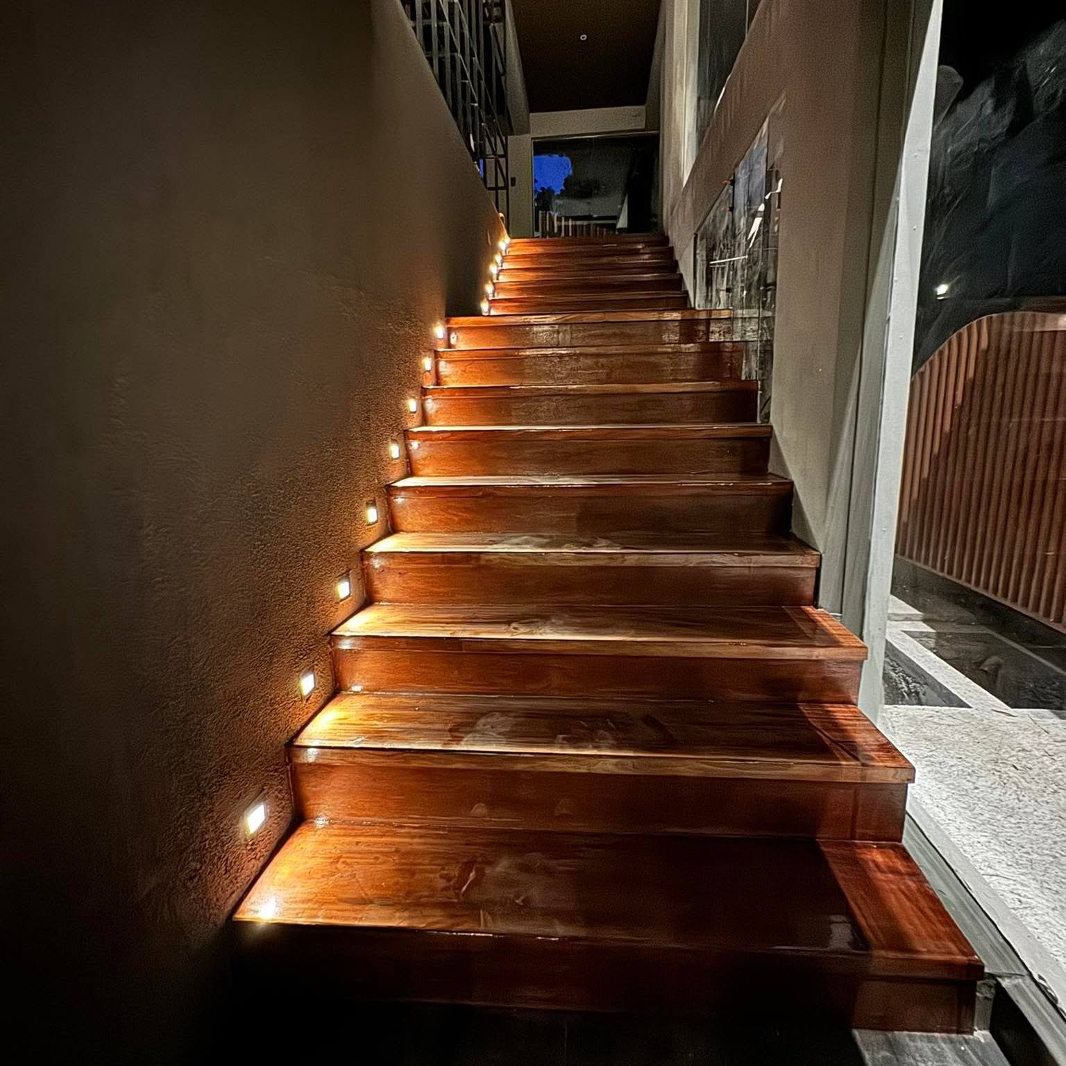 Timber staircase with lighting set into each step
